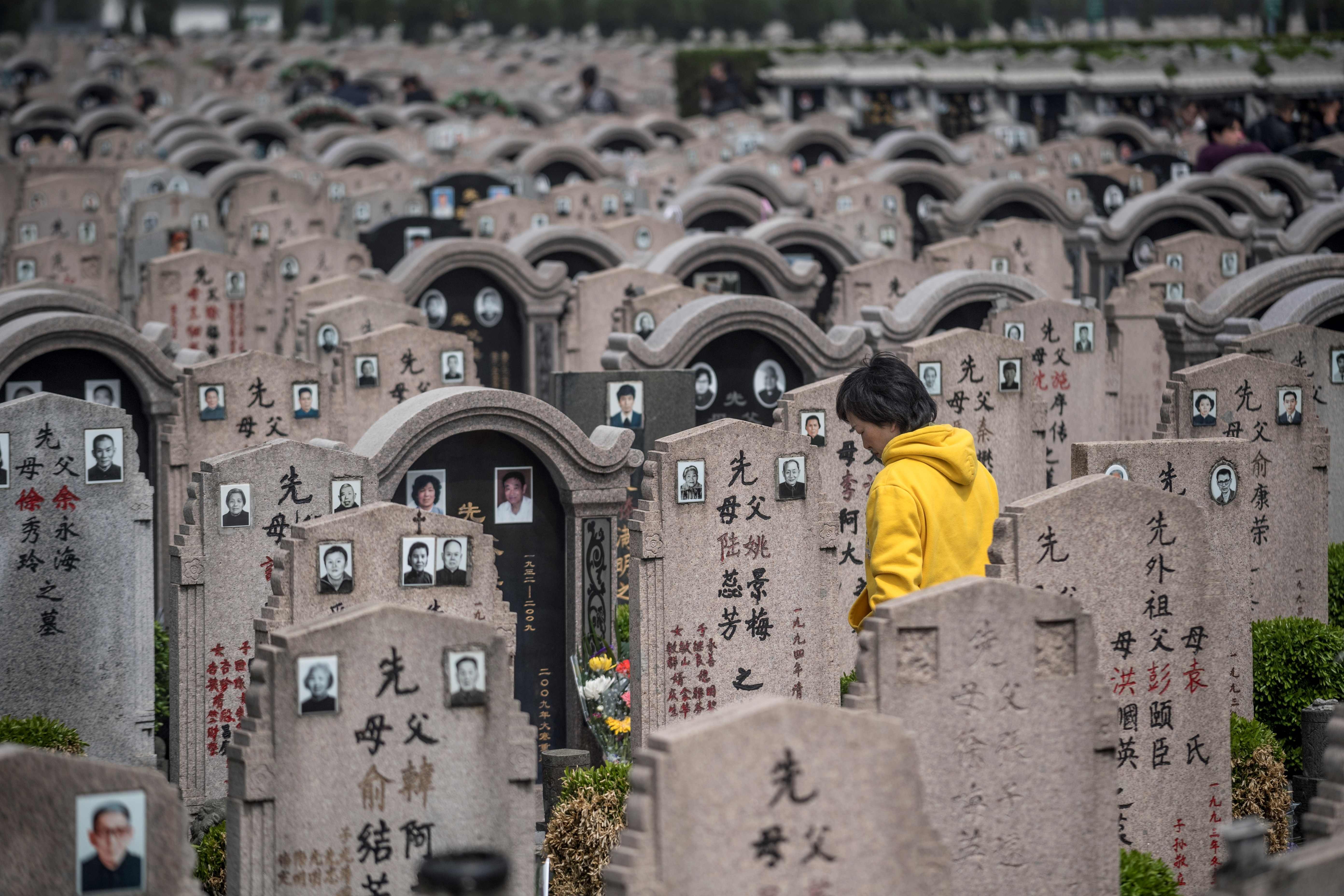 A woman pays her respects to the deceased during the Ching Ming (or Qing Ming) festival last Friday, at a cemetery in Shanghai. It is customary for Chinese people to tend to the graves of their departed loved ones during Ching Ming. Photo: AFP
