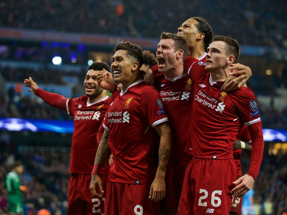 Liverpool’s players celebrate Roberto Firmino’s goal. Photo: Xinhua