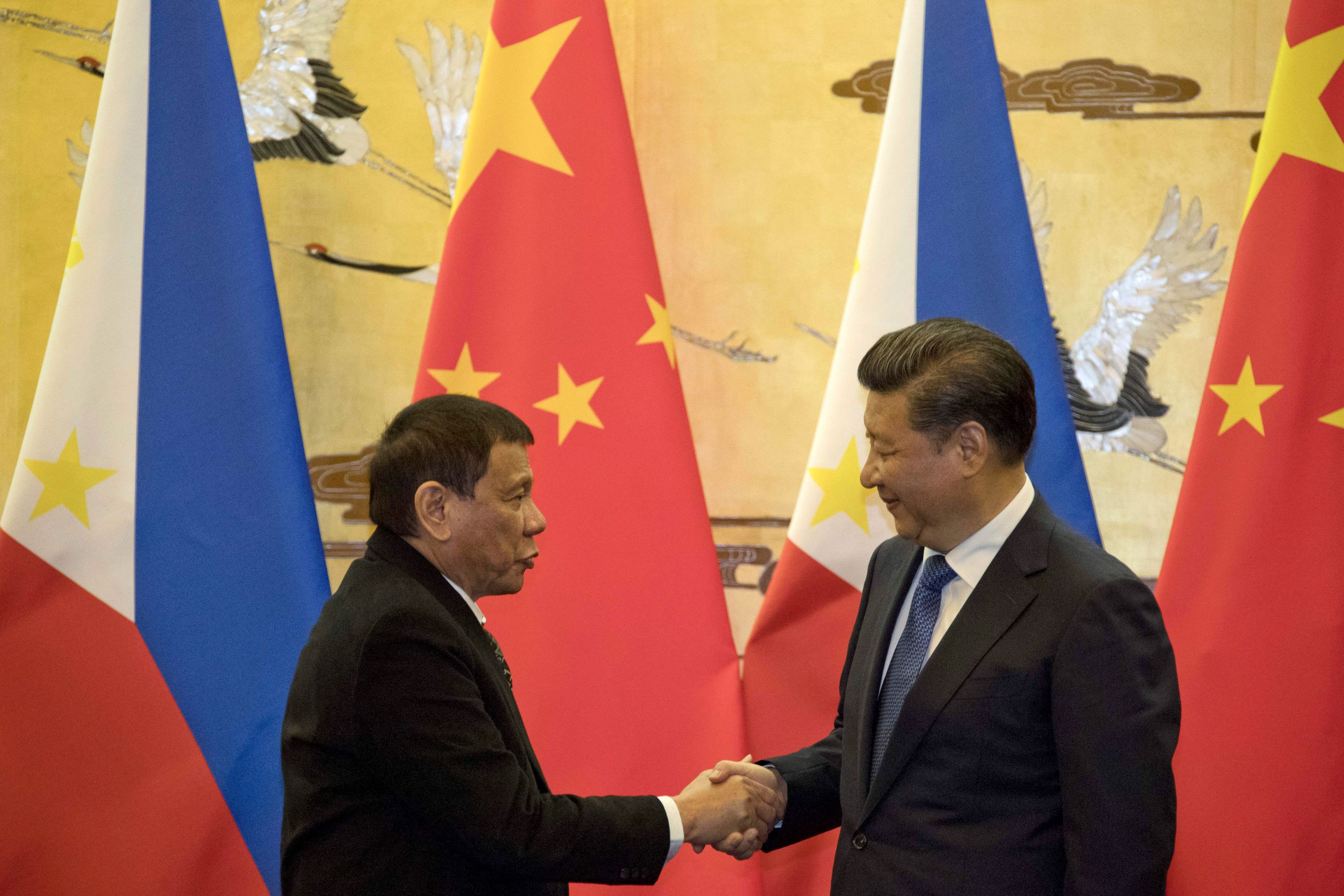 Philippine President Rodrigo Duterte (left) and Chinese President Xi Jinping shake hands after a signing ceremony in Beijing on October 20, 2016. Since taking office in 2016, Duterte has championed an “independent foreign policy” that has distanced the country from its traditional ally, the US. Photo: AFP