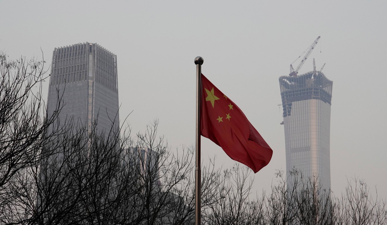 Beijing’s determination to pare debt could slow economic growth. Pictured: China World Trade Center Tower III (left) and China Zun Tower under construction in Beijing's central business area. Photo: Reuters