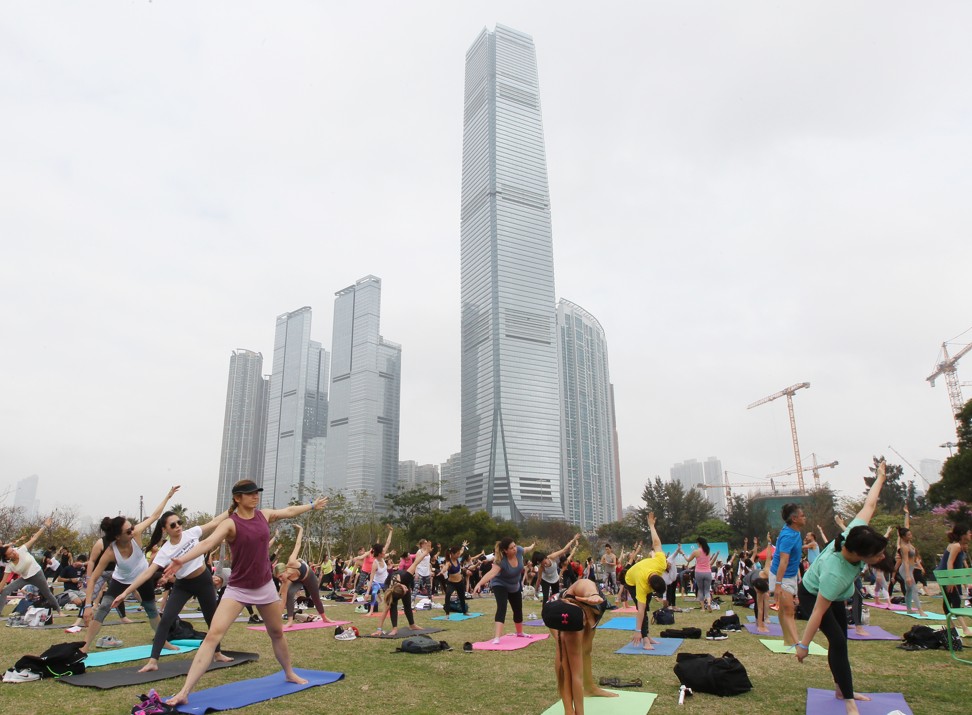 Yoga enthusiasts at the Nursery Park in West Kowloon, on March 3. Photo: Roy Issa