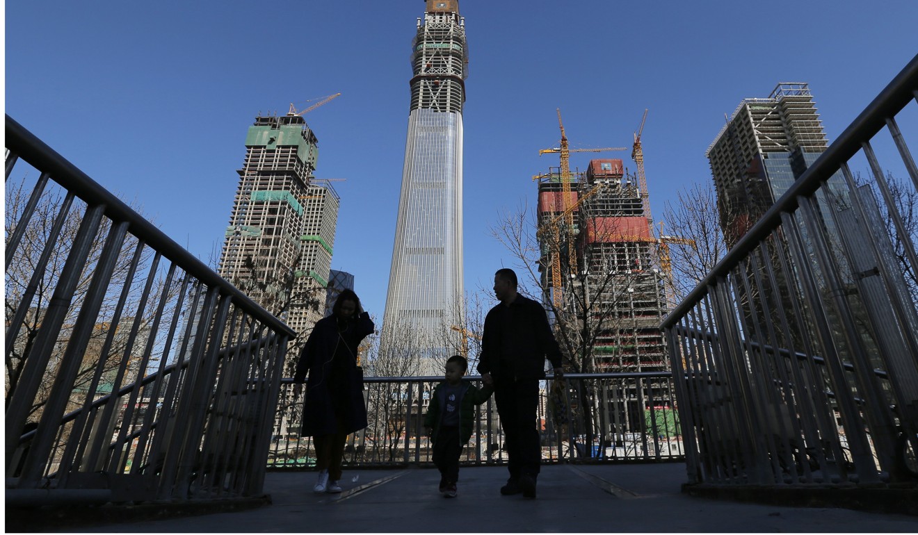 China Zun, a landmark 528 metre, 108-storey building taking shape in Beijing’s CBD as the future headquarters of CITIC Group, looms in background. Photo: EPA