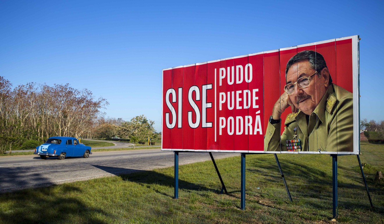 A car drives by a billboard that reads in Spanish ‘¨Ít was, is and will be done’ with a picture of Cuba's President Raul Castro on the outskirts of Havana, Cuba on Wednesday. Photo: AP 