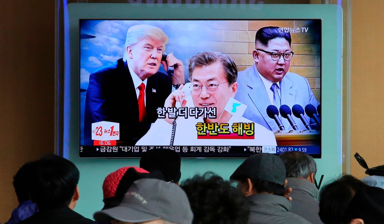 South Koreans watch a TV screen showing images of North Korean leader Kim Jong-un, right, South Korean President Moon Jae-in and US President Donald Trump. Photo: AP