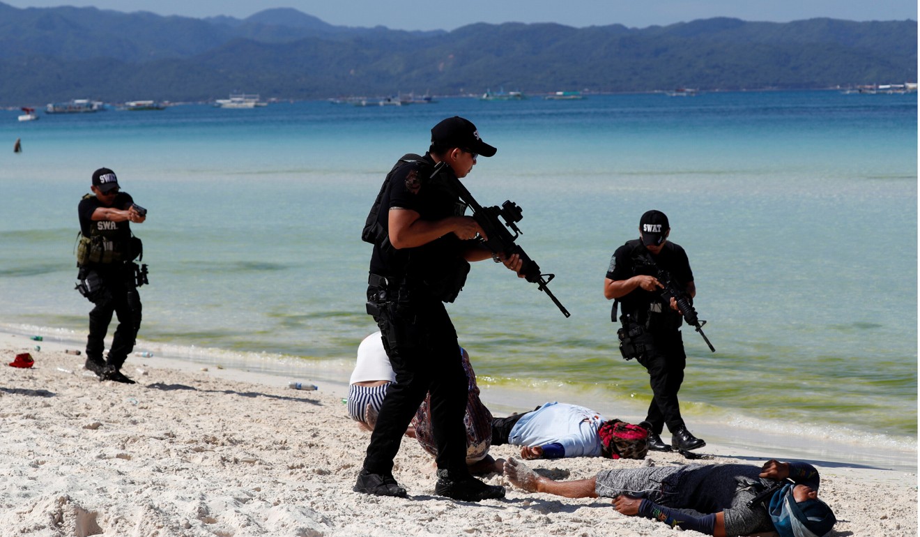 Members of a police SWAT team take part in a hostage taking drill, a day before the temporary closure of the holiday island Boracay, in the Philippines on April 25, 2018. Photo: Reuters