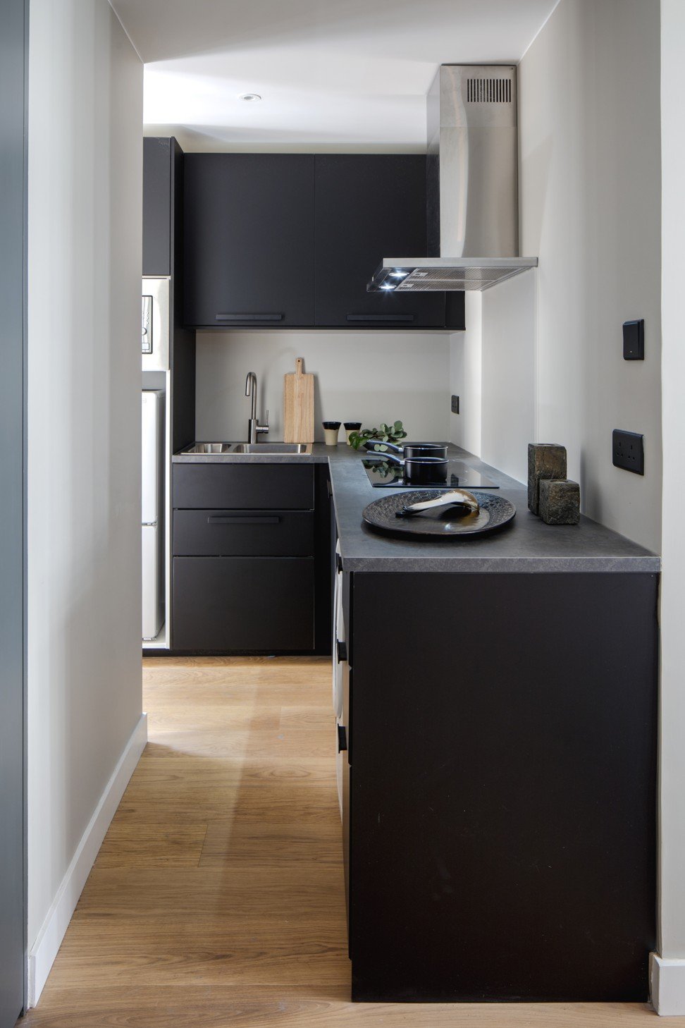 A galley kitchen works well in a small, narrow space such as this one.