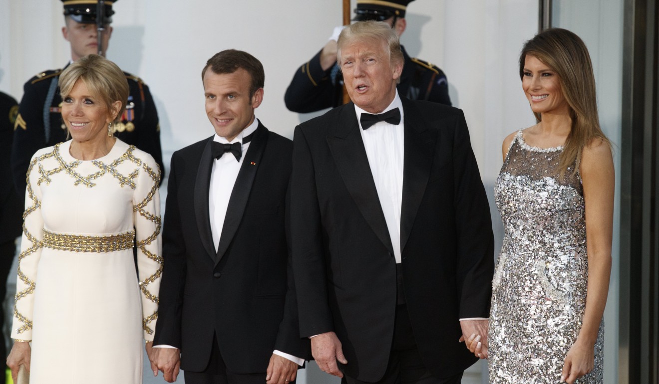 US President Donald Trump (second right) and First Lady Melania Trump (right) welcome French President Emmanuel Macron and French First Lady Brigitte Macron in the North Portico of the White House in Washington on Tuesday ahead of a state dinner. Photo: AP