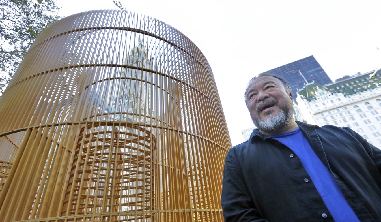 Chinese activist artist Ai Weiwei poses by his work 