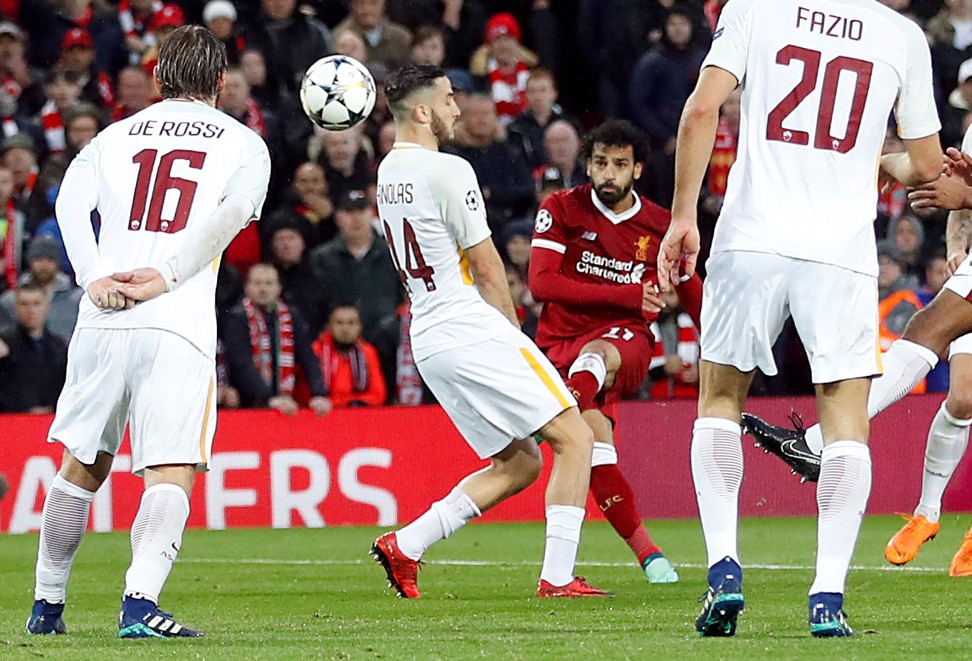 Salah cuts in from the right and bends in the opening goal at Anfield. Photo: Reuters
