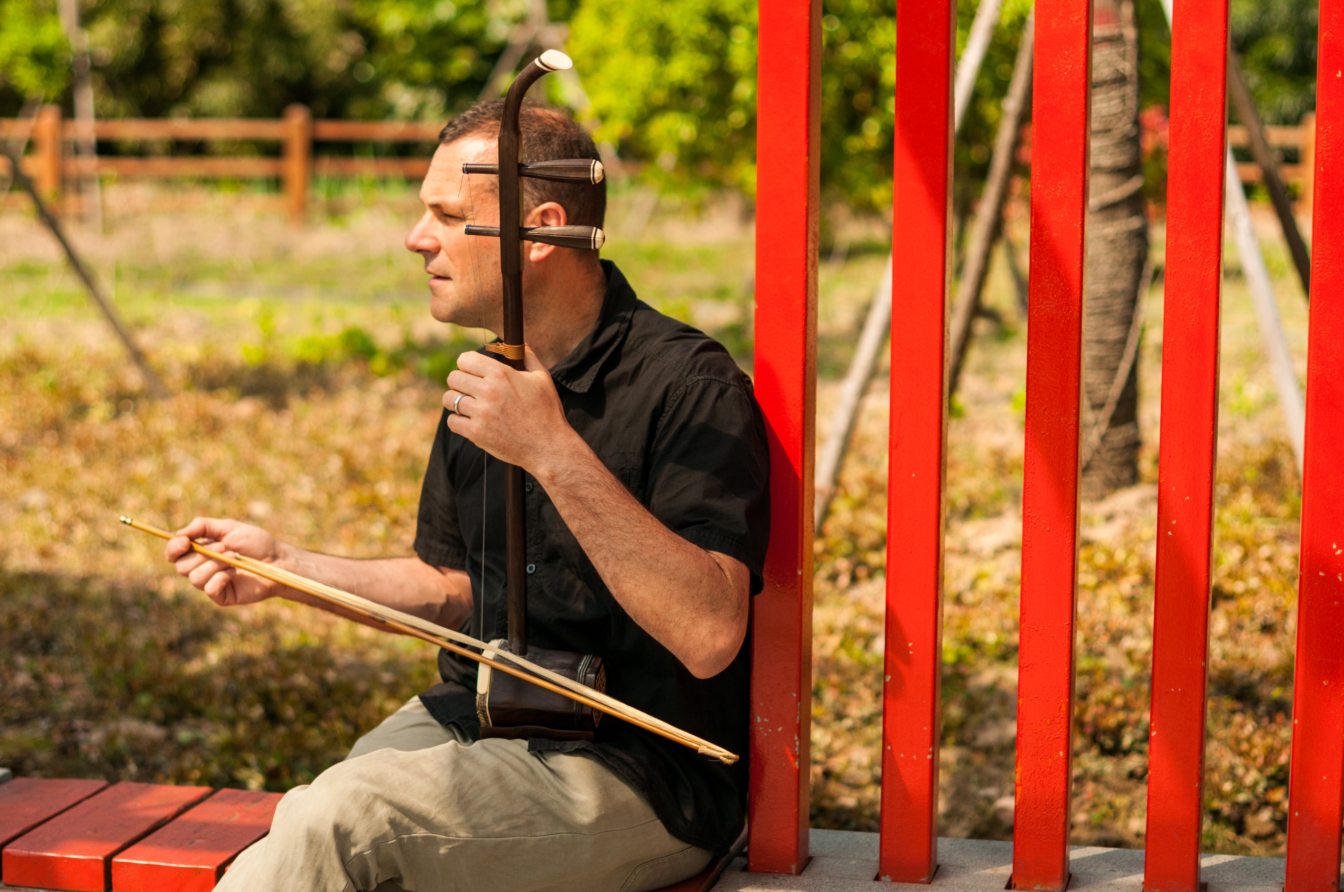 Canadian musician Jeremy Moyer playing the Chinese erhu in a park in Shanghai, China. Photo: Mark Andrews