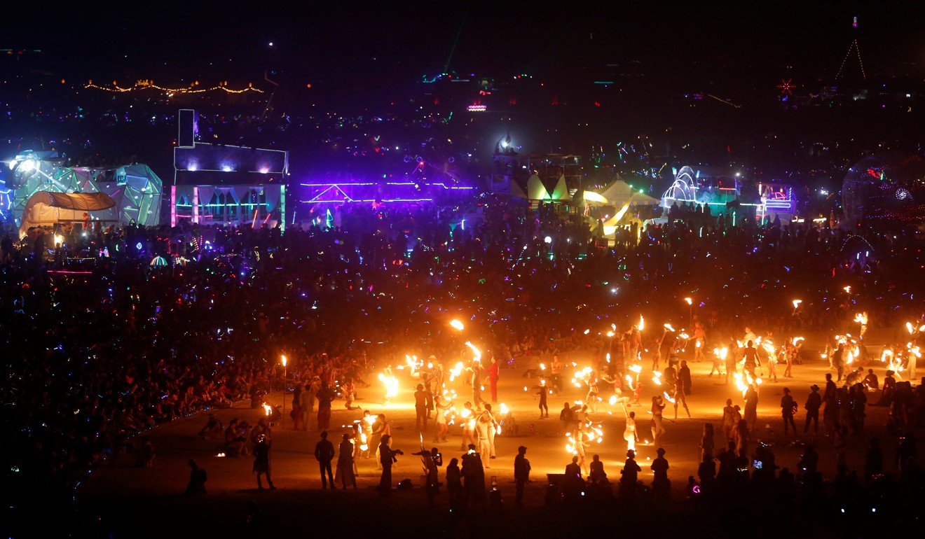 Thousands of participants gather to watch the Man burn at the 2017 festival. Photo: Reuters