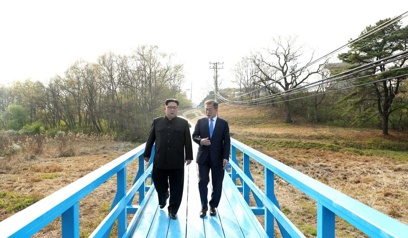 Kim and Moon strolling around the Peace House grounds on April 27, 2018. Photo: EPA