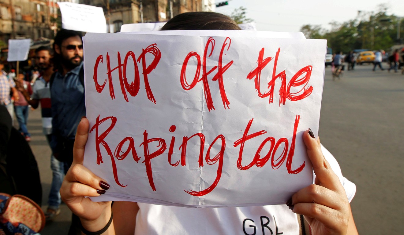 A woman holds a placard during a protest against the rape of an eight-year-old girl in Kathua near Jammu. Photo: Reuters