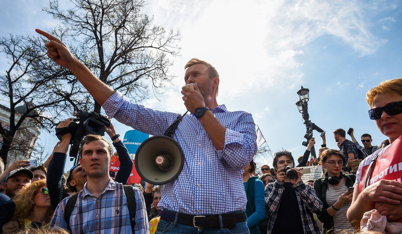 Alexei Navalny speaks with his supporters during an unauthorised opposition rally. Photo: EPA