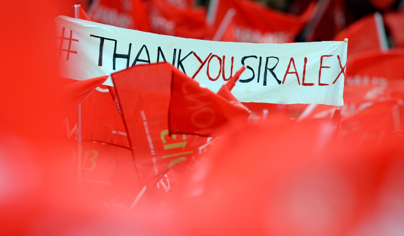 A banner thanks the former Manchester United manager ahead of his retirement in 2013. Photo: AFP