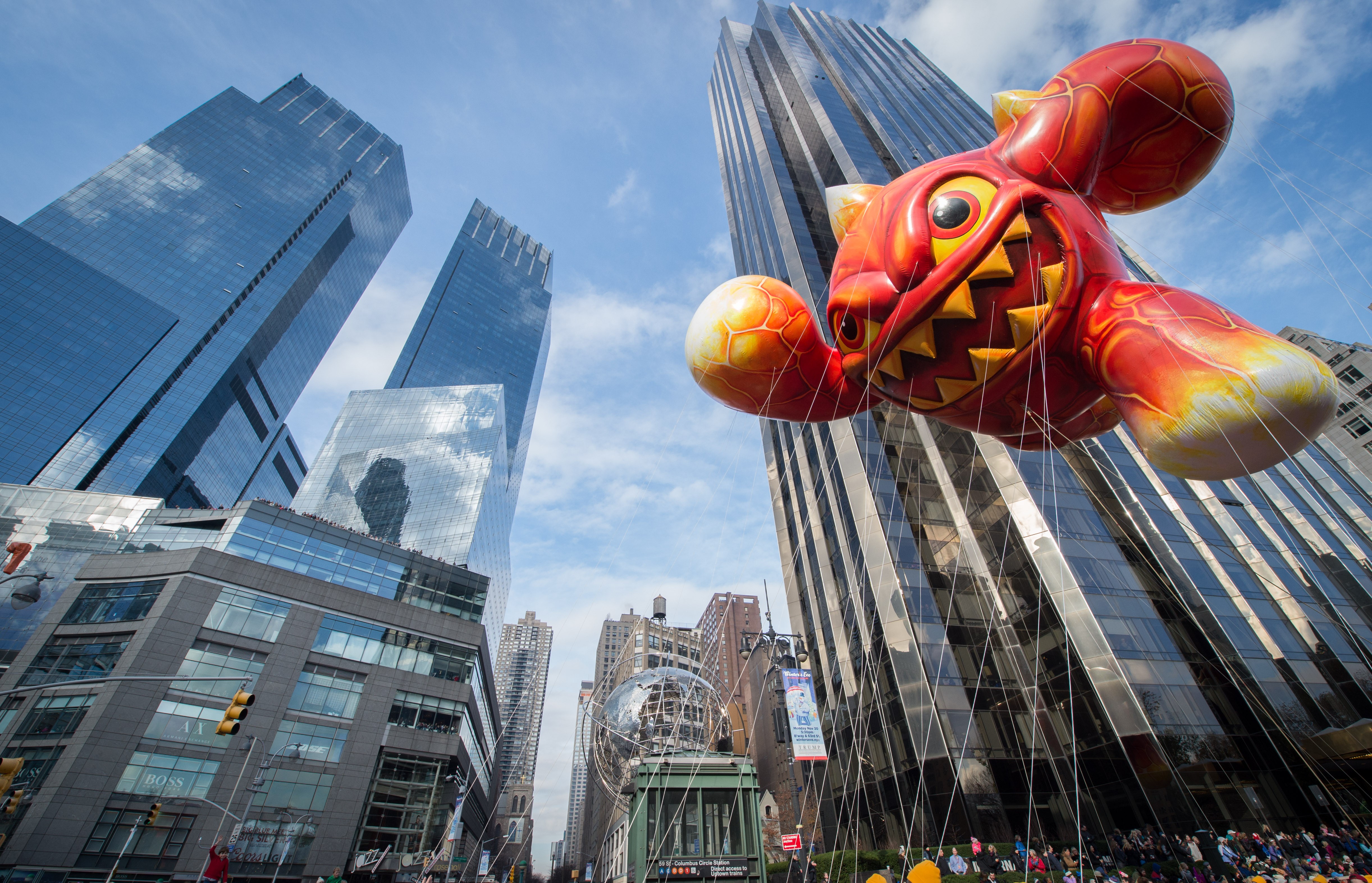 The Macy's Thanksgiving Day Parade moves through Columbus Circle in New York. Deutsche Bank’s new Midtown address will be One Columbus Circle, which is part of the complex at the 80-story, twin-towered Time Warner Center. Photo: AP