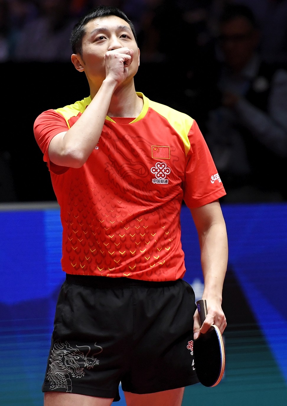 China’s Xin Xu reacts after defeating Germany’s Patrick Franziska.