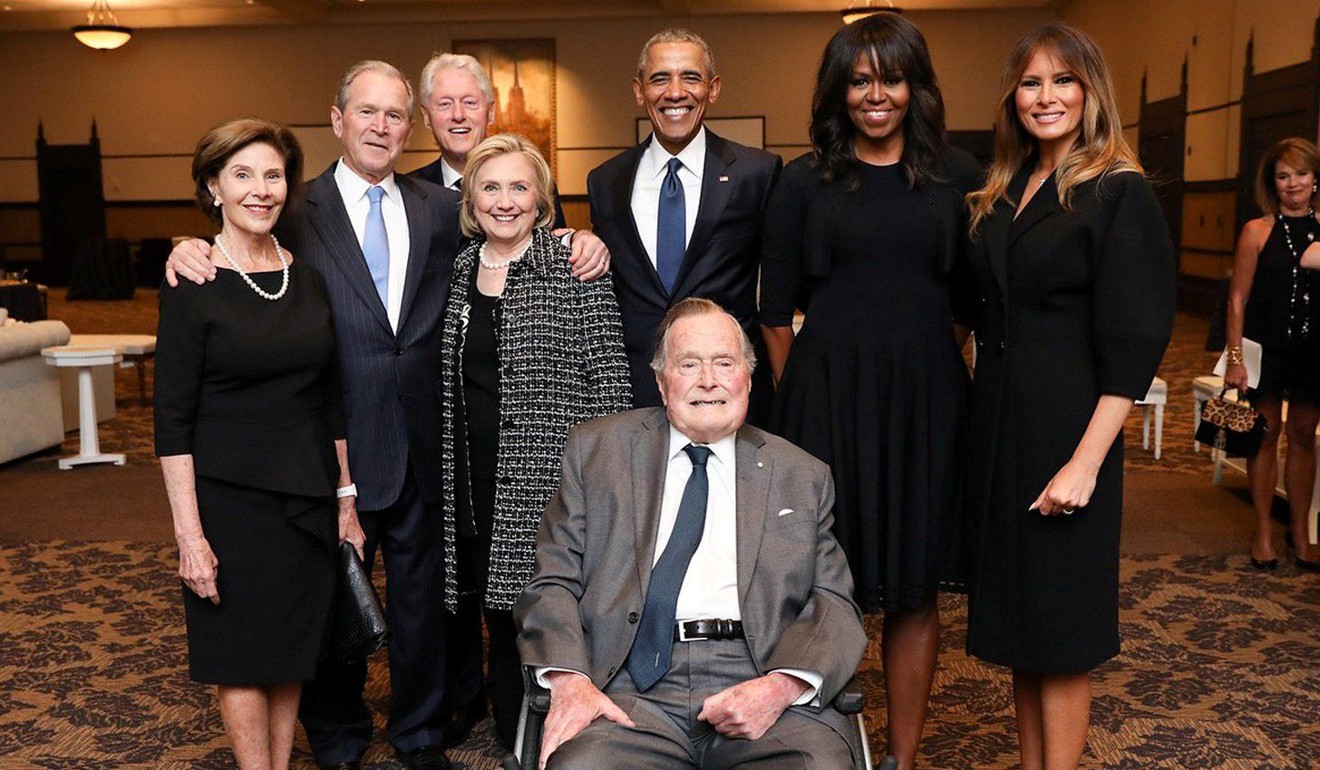 From left, former US Presidents and first ladies Laura Bush, George W. Bush, Bill Clinton, Hillary Clinton, Barack Obama, Michelle Obama stand with first lady Melania Trump behind former US President George H.W. Bush at the funeral of former first lady Barbara Bush in Houston, Texas, on April 21. Photo: Paul Morse/Office of George H.W. Bush/handout via Reuters 
