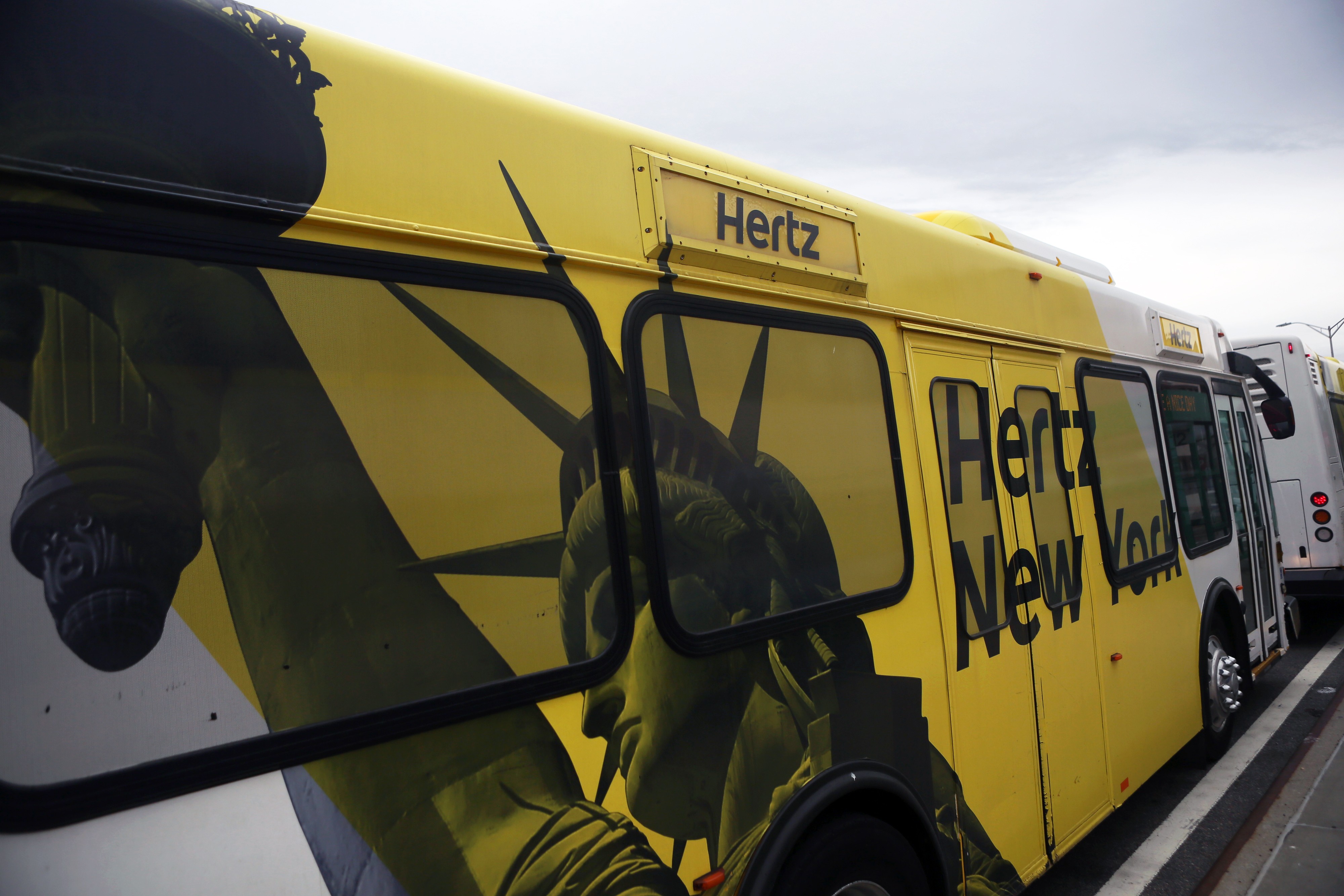 An image of the Statue of Liberty is displayed on a shuttle bus at LaGuardia Airport in New York. The US economy draws its strength from its transparent, fair and democratic system. Photo: Bloomberg 