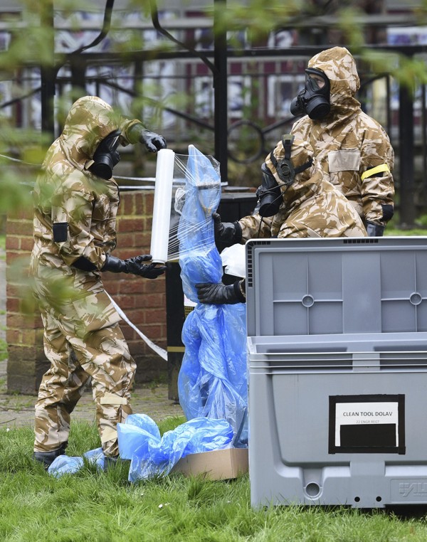 British military personnel inspect the area where former Russian agent Sergei Skripal and his daughter, Yulia, were found after they had been poisoned in Salisbury, Britain, in March. Picture: AP
