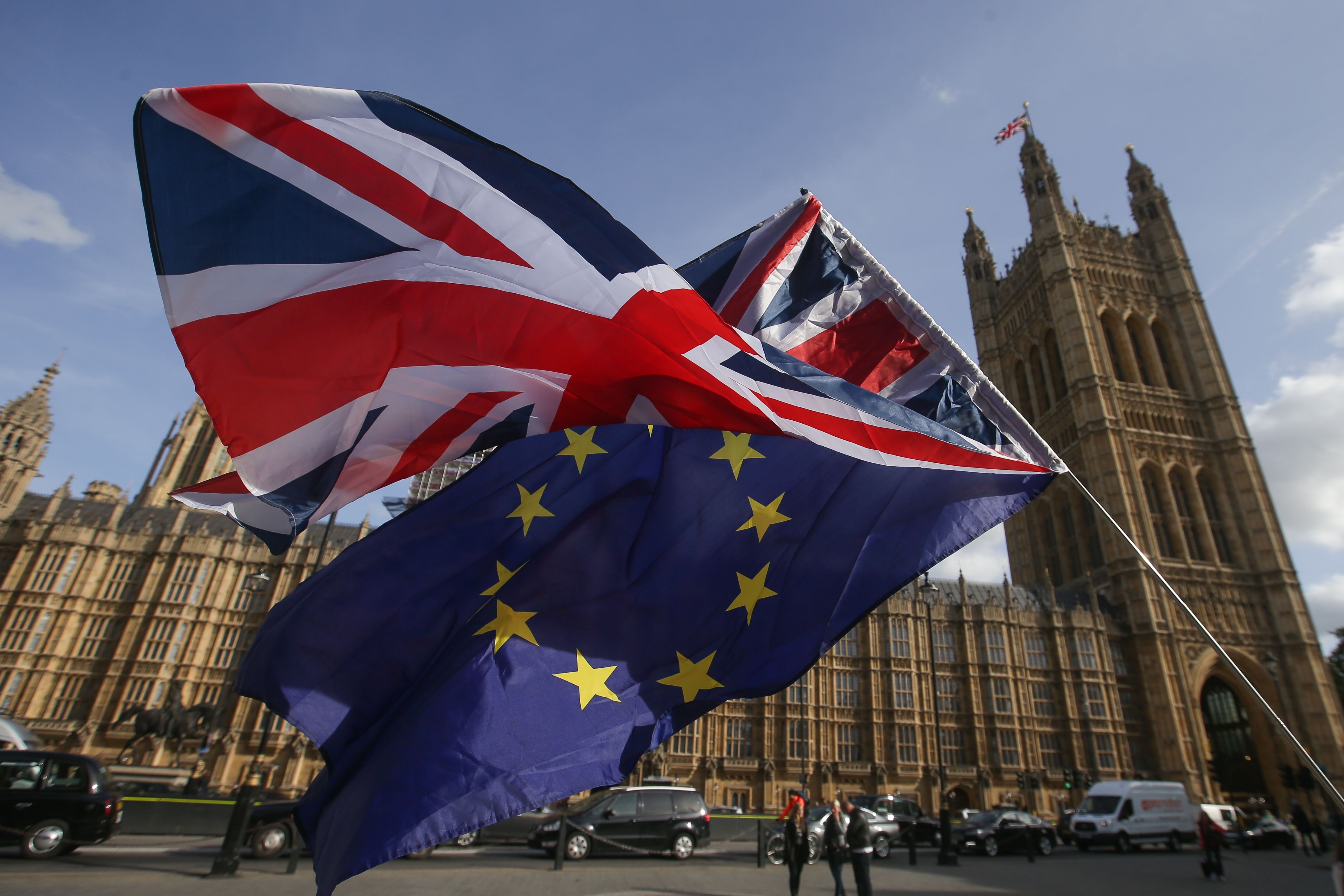 Demonstrators fly a Union Jack flag  and an EU flag outside the Houses of Parliament in Westminster, central London, in October 2017. London has been ranked as the top global financial centre, but its post-Brexit fate remains unclear. Photo: AFP  