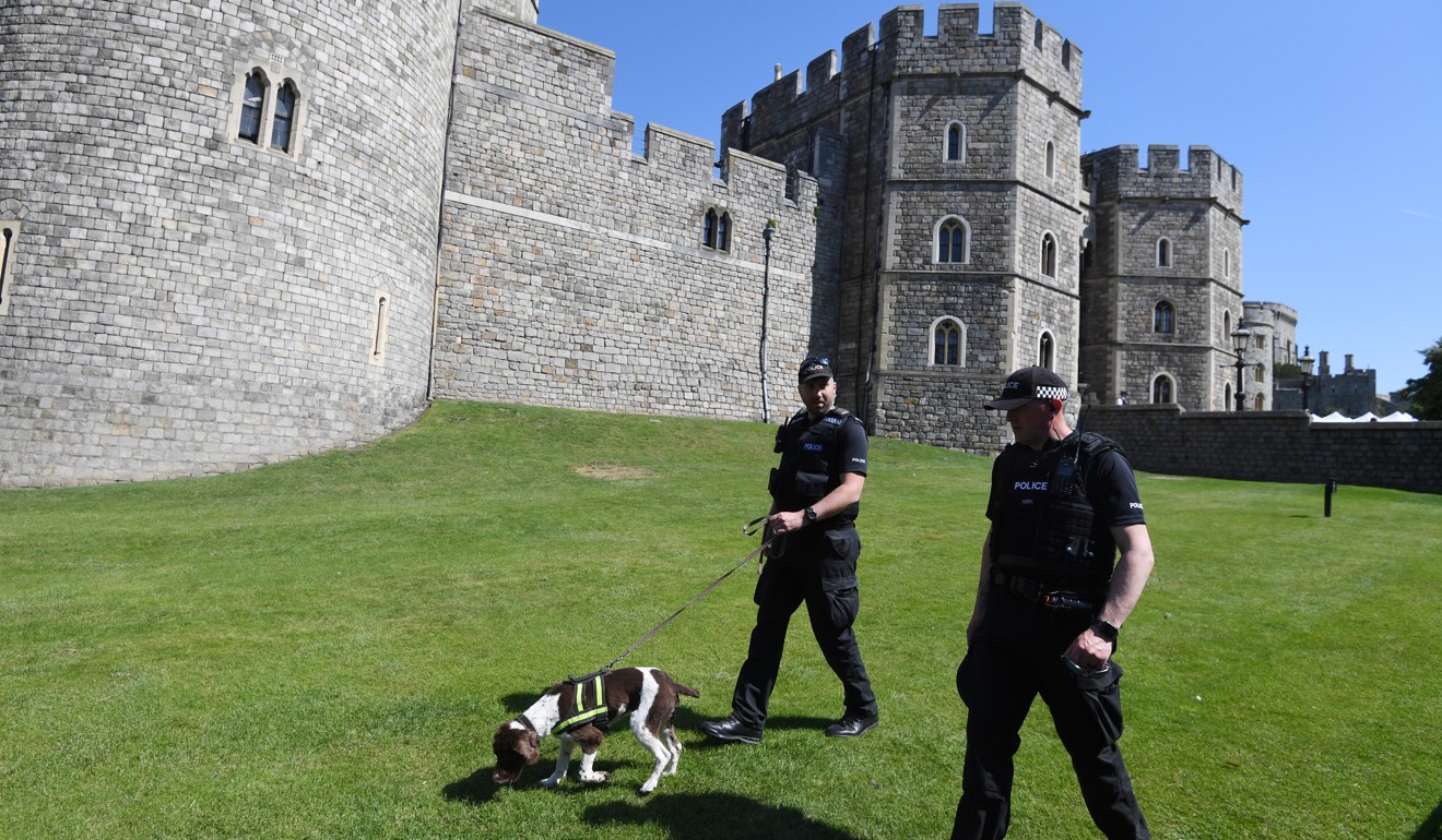 British police patrol Windsor Castle in Windsor, England, on Tuesday, ahead of the wedding on Saturday of Britain’s Prince Harry to the American actress Meghan Markle. Photo: EPA-EFE