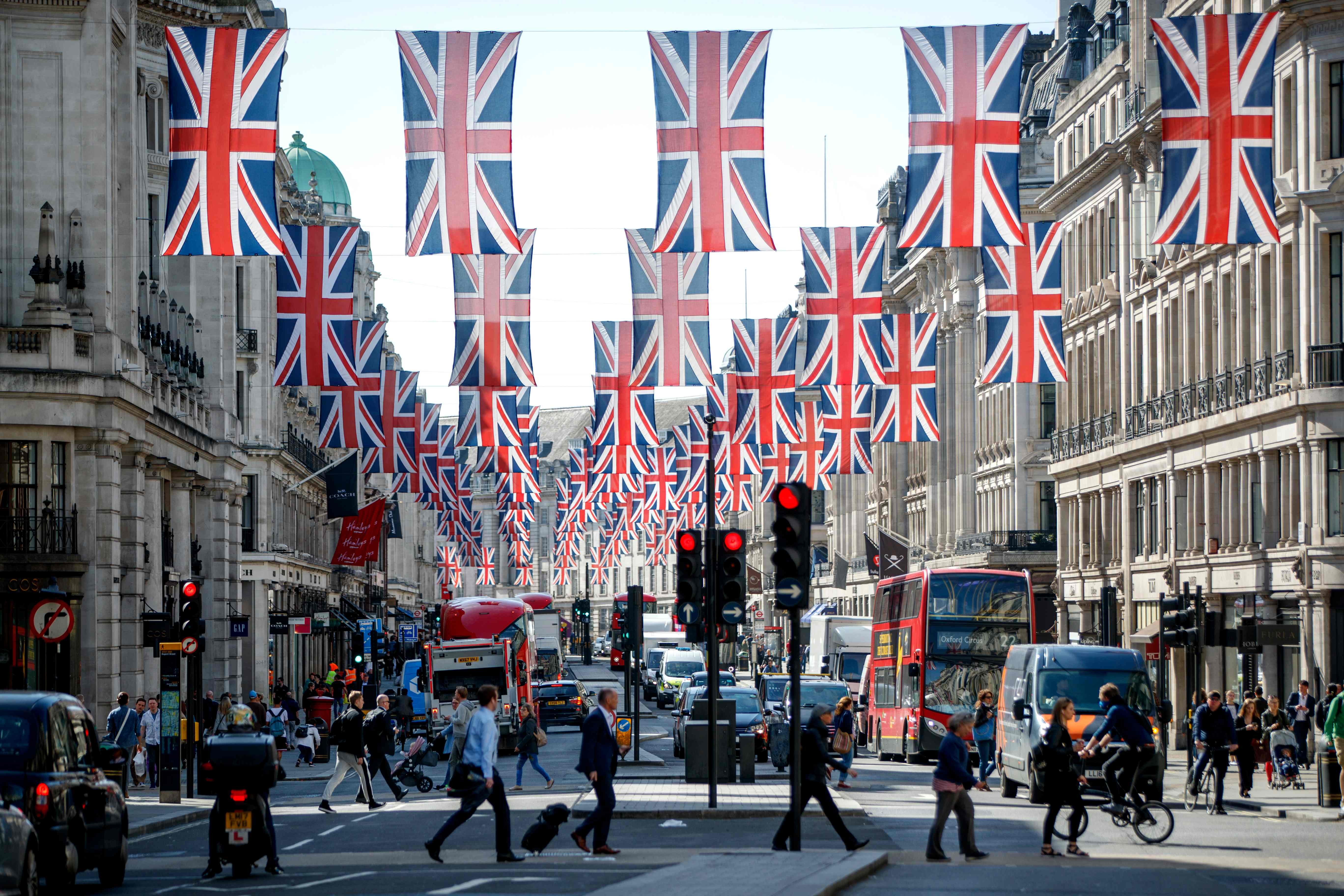 Union flags decorate Regent Street in London on May 11, ahead of the royal wedding of Prince Harry and US actress Meghan Markle. Britain is going through a new period of great reform known as Brexit. Once out of the EU, Britain will be free to control its own trade policy, embrace free markets, and look across the globe for partnerships. Photo: AFP  