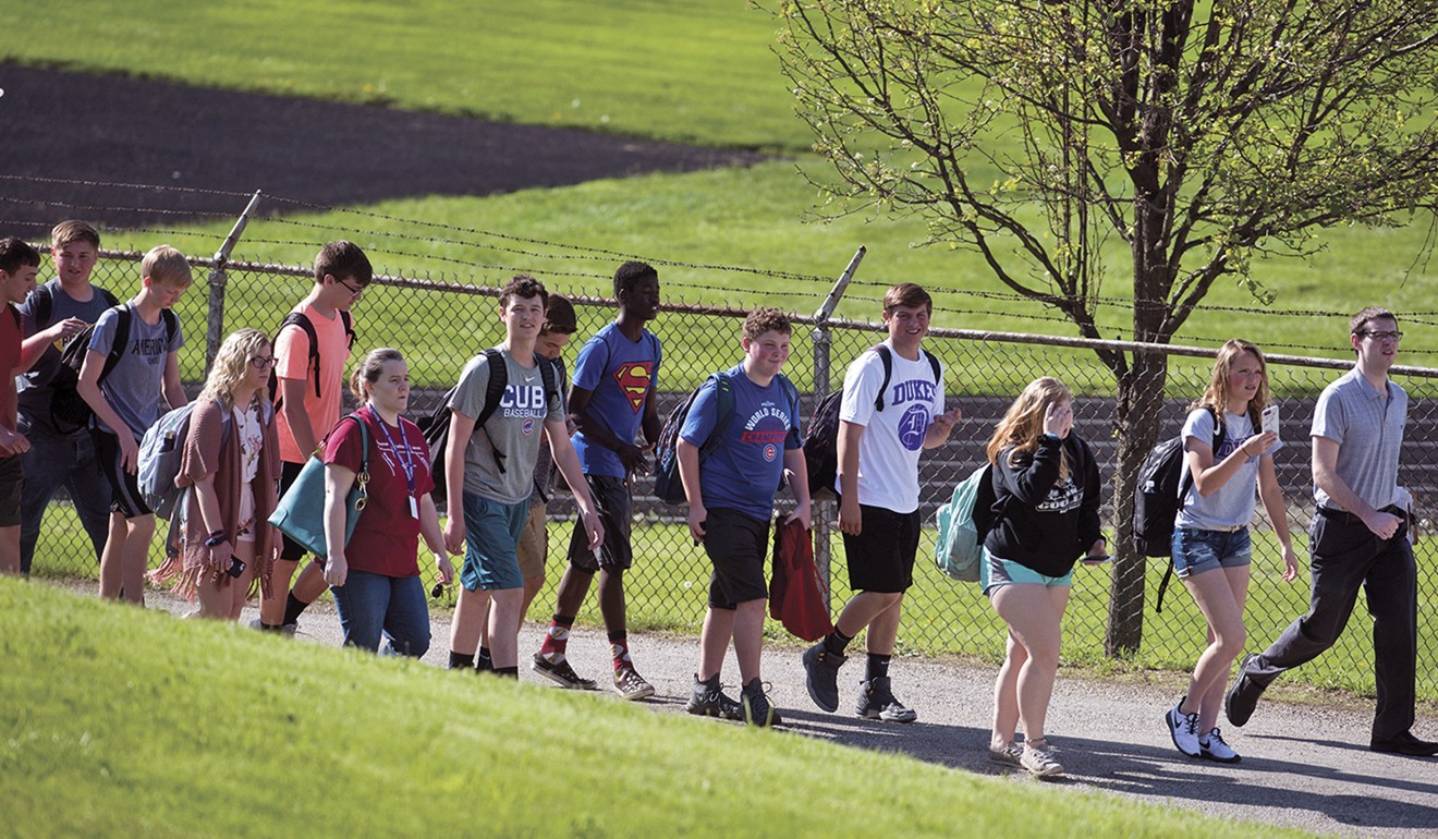 Students file into the adjacent National Guard Armory after a shooting at Dixon High School in Illinois on Wednesday. Photo: Sauk Valley Media via AP