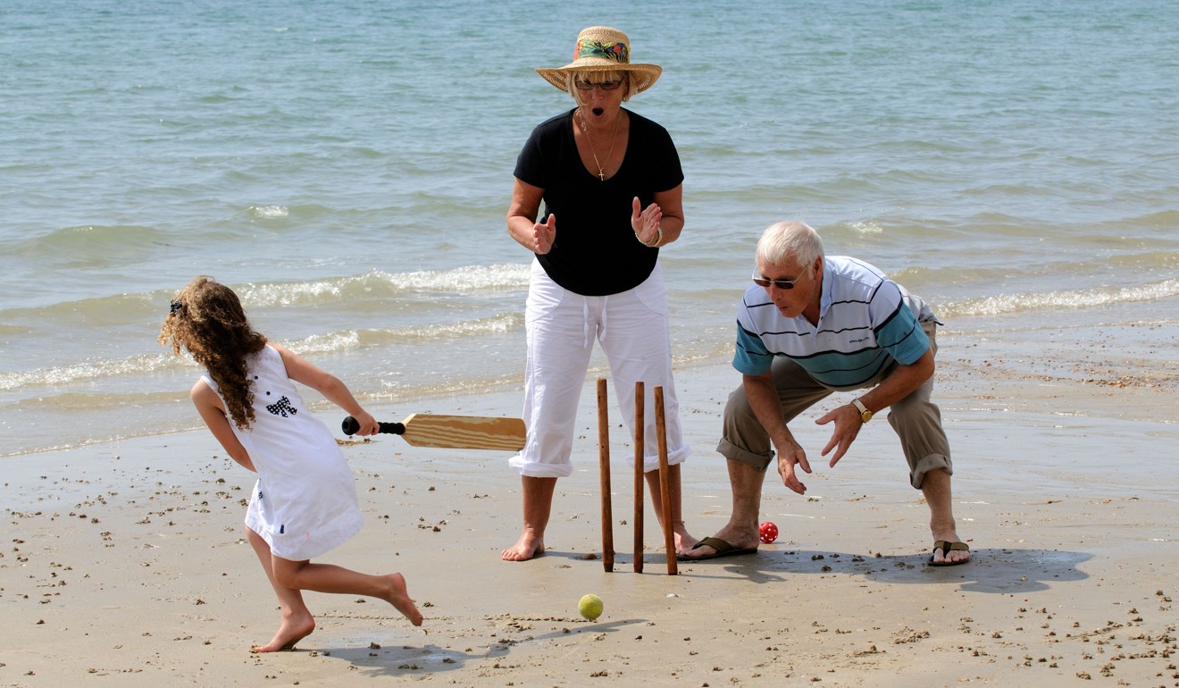 Beach or mountain? Talk to your grandchildren about whether they’ll be happier on the beach playing games such as beach cricket, or having an interest holiday such as a hiking trip. Photo: Alamy