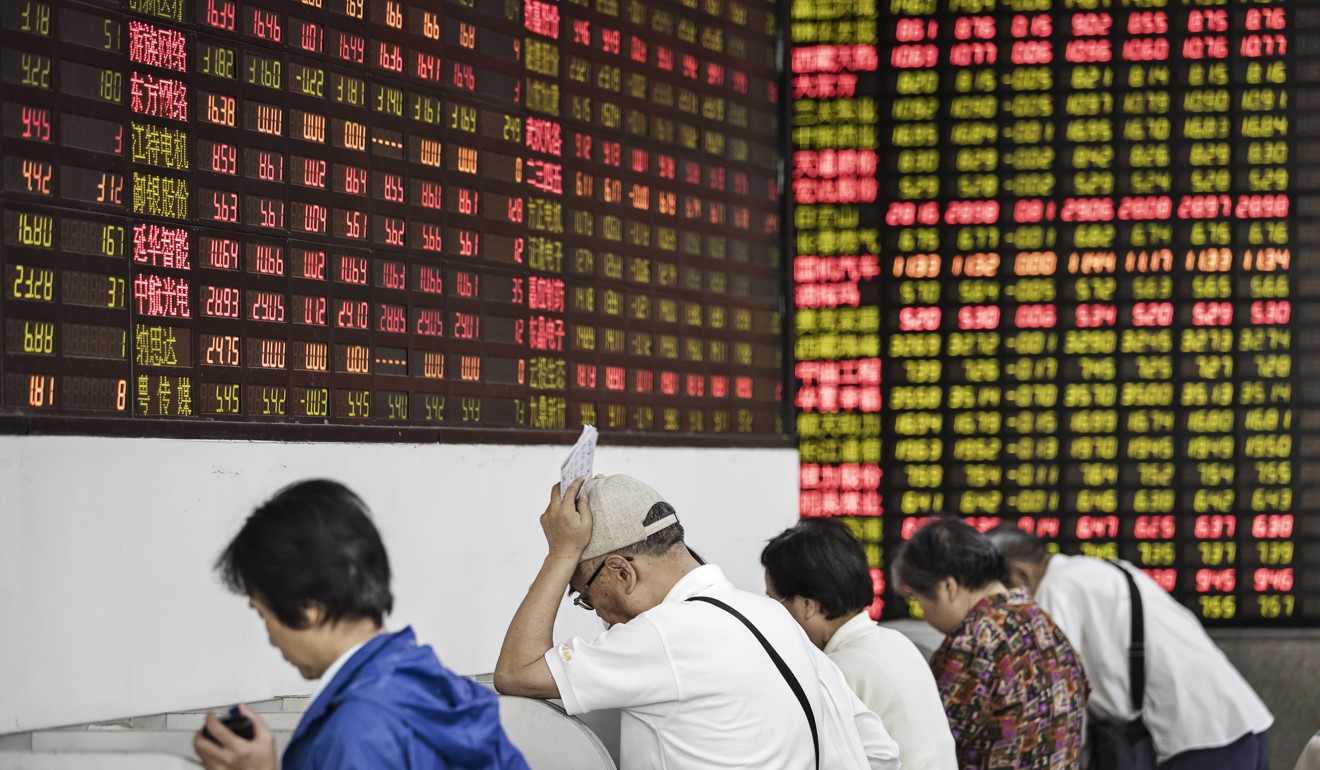 Investors stand at trading terminals at a securities brokerage in Shanghai in June 2017. Retail investors tend to take a speculative and theme-driven approach to the stock market. Photo: Bloomberg