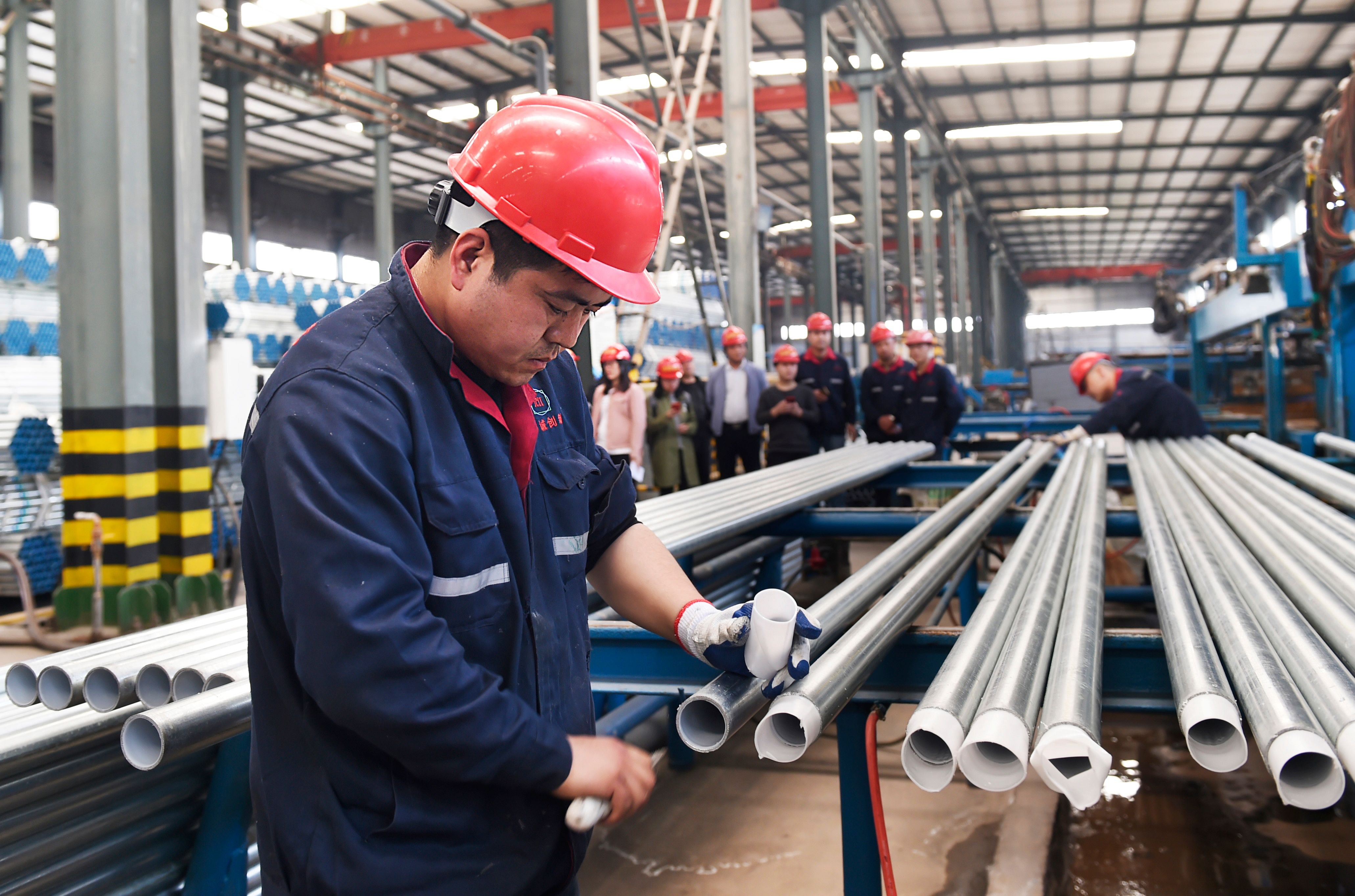 A worker checks steel pipes at a factory in Zouping, Shandong province, in April. Tariffs on steel and aluminium imports from China were Donald Trump’s opening salvo in the trade dispute between the two countries. Photo: AFP 