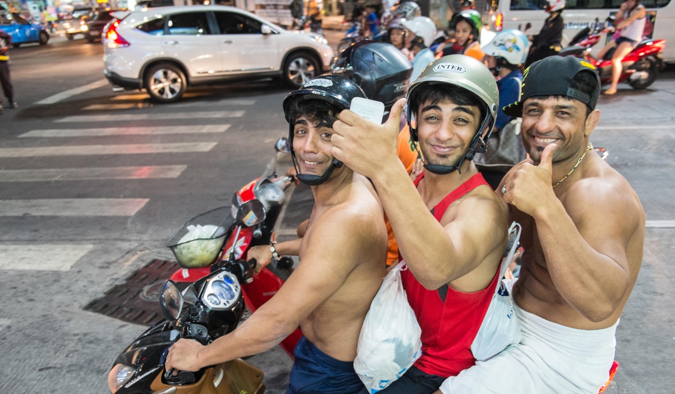 Tourists on a scooter in Pattaya,Thailand. Picture: Alamy