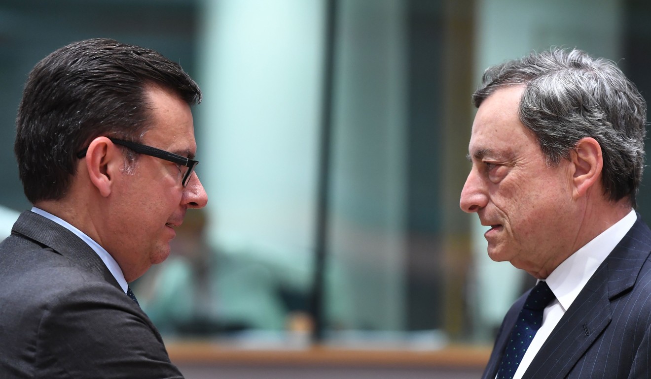 ECB President Mario Draghi (right) speaks to Spain’s Finance Minister Roman Escolano during a euro group finance ministers’ meeting at the European Council in Brussels on May 24. The ECB plans to call time on its quantitative easing programme at the end of this year, but if the return of instability in the euro zone puts markets under more severe strain, it will come under intense pressure to shelve its plans to tighten policy. Photo: AFP