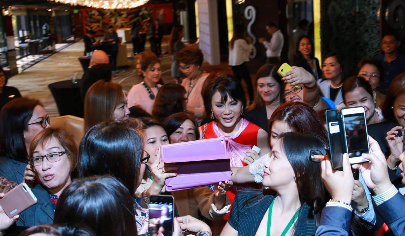 Vicki Belo surrounded by fans at an event in Manila.
