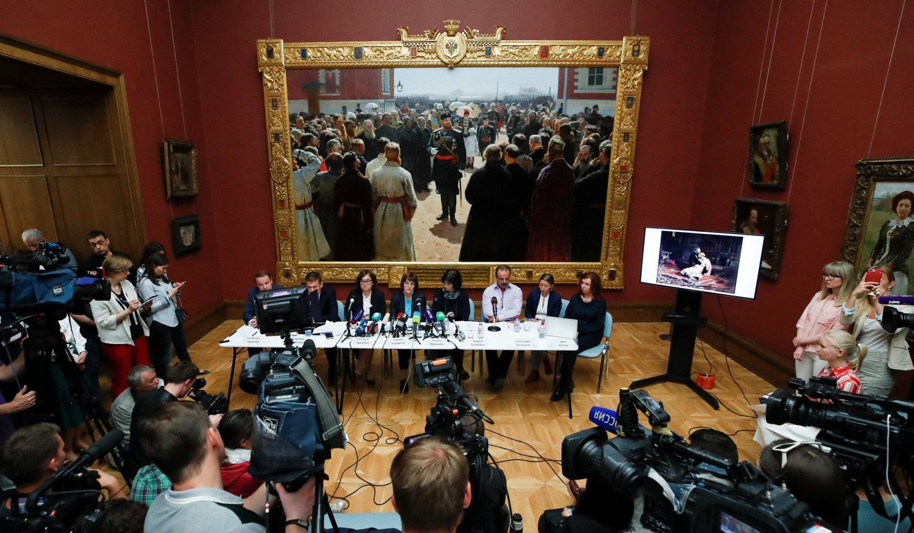 Participants attend a news conference dedicated to the damaged painting at the State Tretyakov Gallery in Moscow on Monday. Photo: Reuters