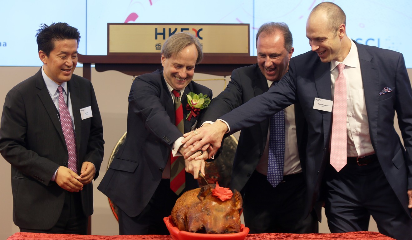 MSCI officials at the celebration ceremony on Thursday. From left, managing director and head of Asia Pacific client coverage Jack Lin; MSCI president Baer Pettit; chief operating officer and chief client officer Laurent Seyer; and head of Hong Kong and Taiwan client coverage Adam Balukonis. Photo: SCMP