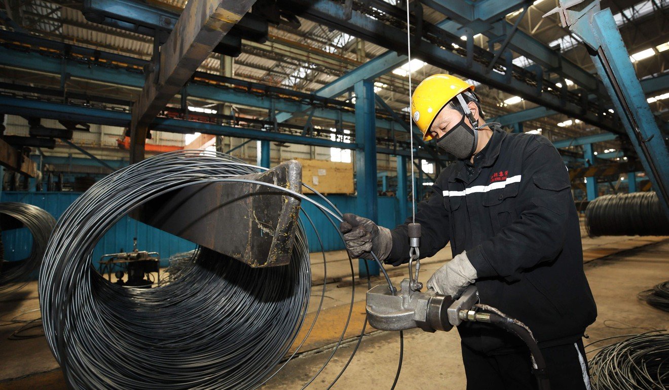 A worker handling cable at a steel factory in Lianyungang in eastern Jiangsu province. Photo: Agence France-Presse