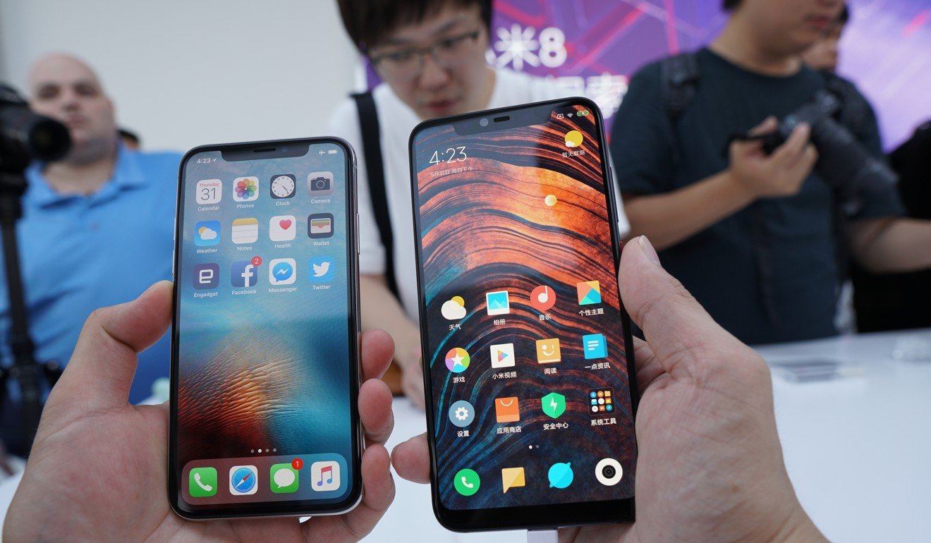 Spot the difference: the Xiaomi Mi 8 (right) side by side with the Apple iPhone X. Photo: Ben Sin