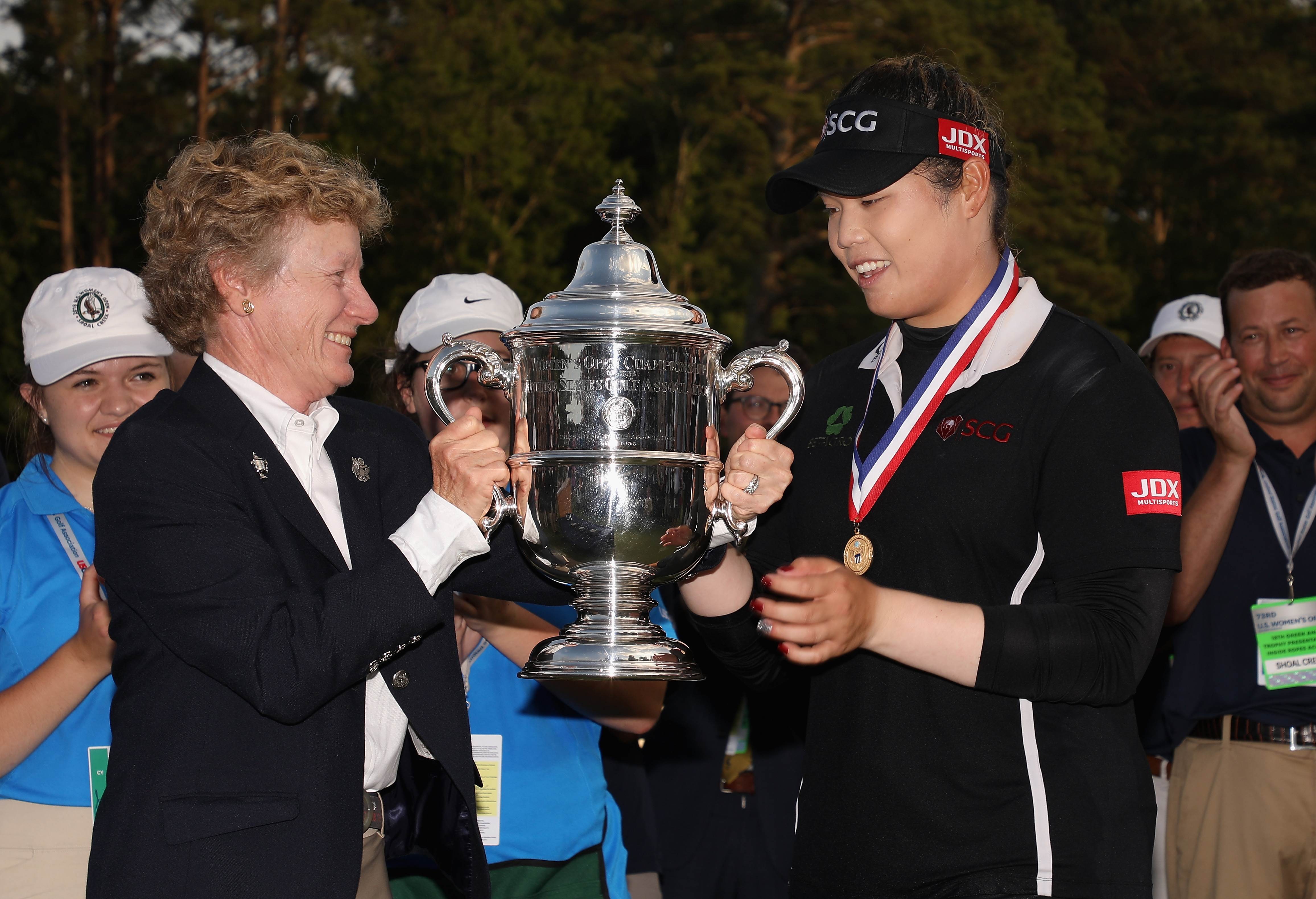 Ariya Jutanugarn of Thailand is awarded the 2018 US Women’s Open trophy after winning in a play-off. Photo: AFP
