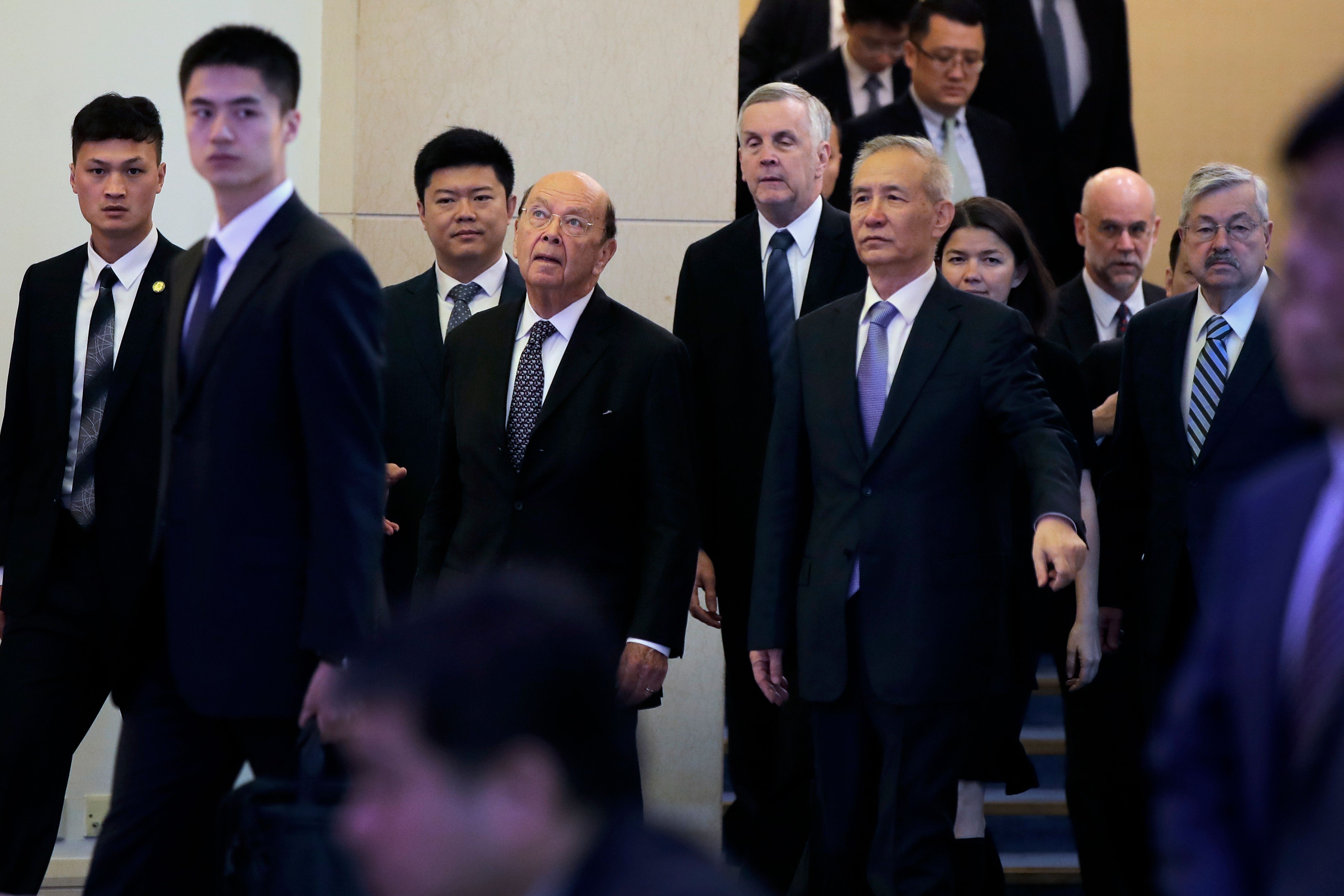 US Commerce Secretary Wilbur Ross (third from left) and Chinese Vice Premier Liu He arrive to attend a meeting at the Diaoyutai State Guesthouse in Beijing on Sunday. Photo: AFP