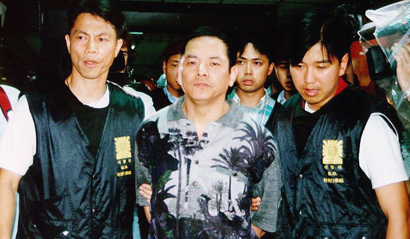 Wan is escorted by Macau police in 1998. Photo: SCMP Pictures