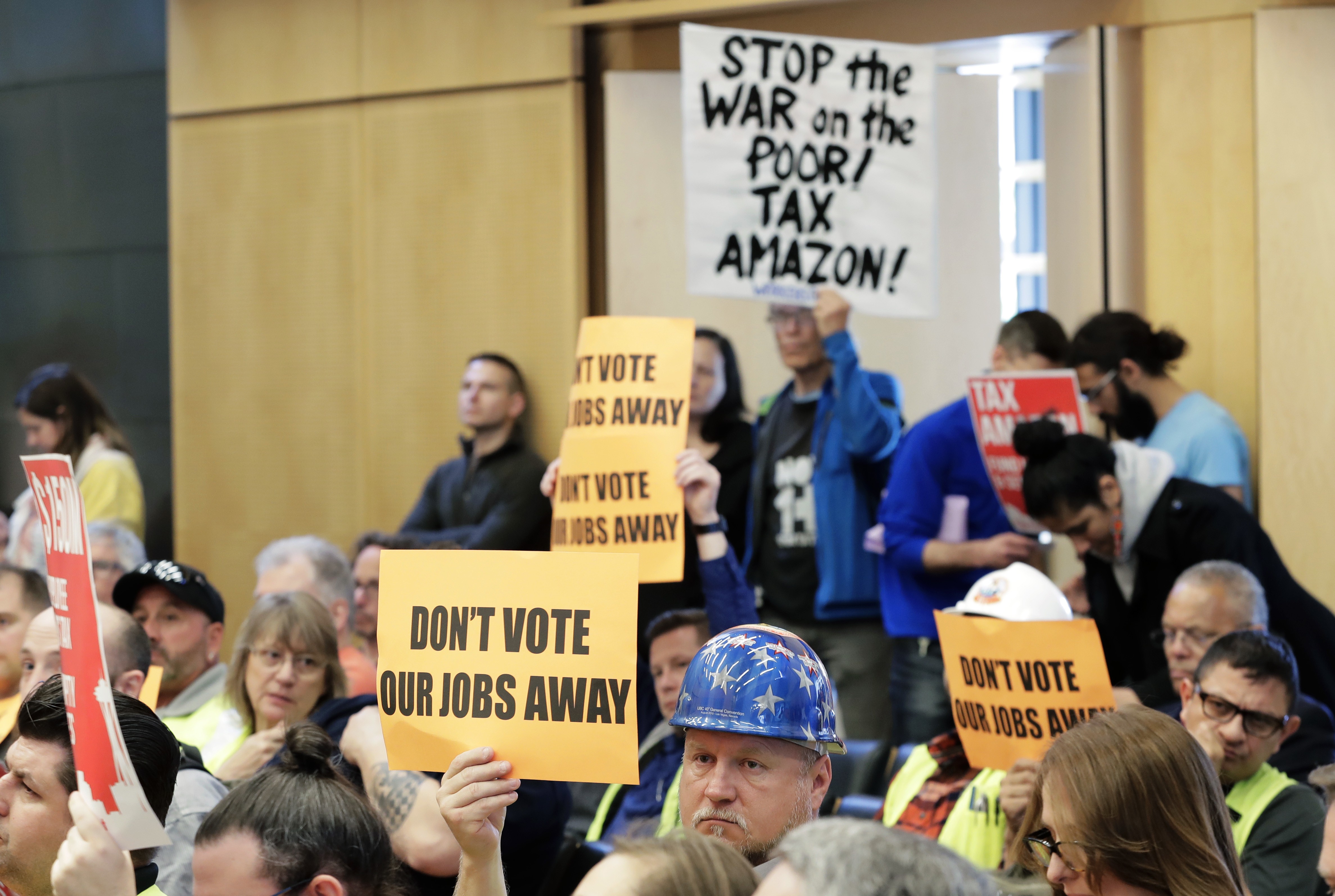 Protesters in Seattle calls for the City Council to tax large businesses such as Amazon to fund efforts to combat homelessness. Photo: AP