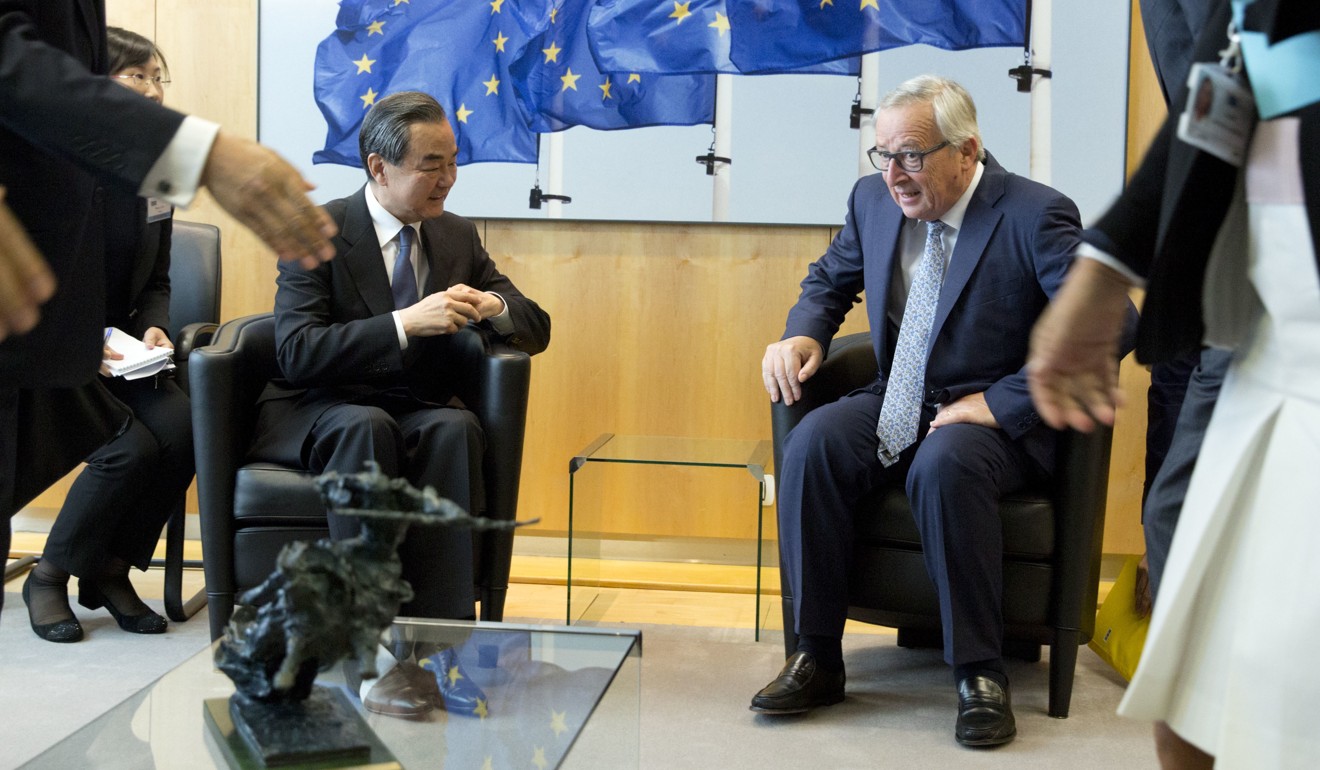 China's Foreign Minister Wang Yi meets European Commission President Jean-Claude Juncker at EU headquarters in Brussels, Belgium. Photo: AP