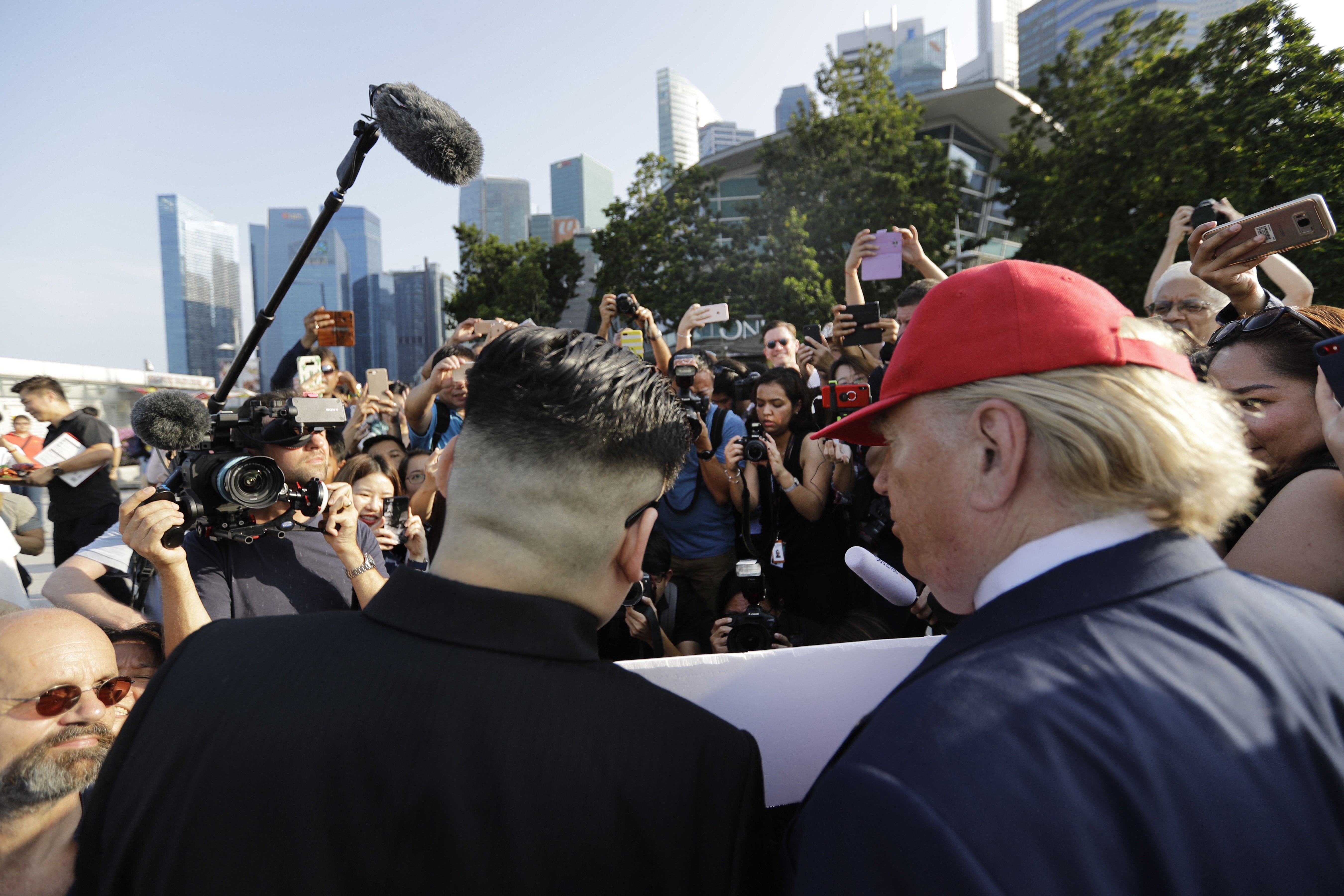 Kim Jong-un and Donald Trump impersonators in Singapore. Photo: AP