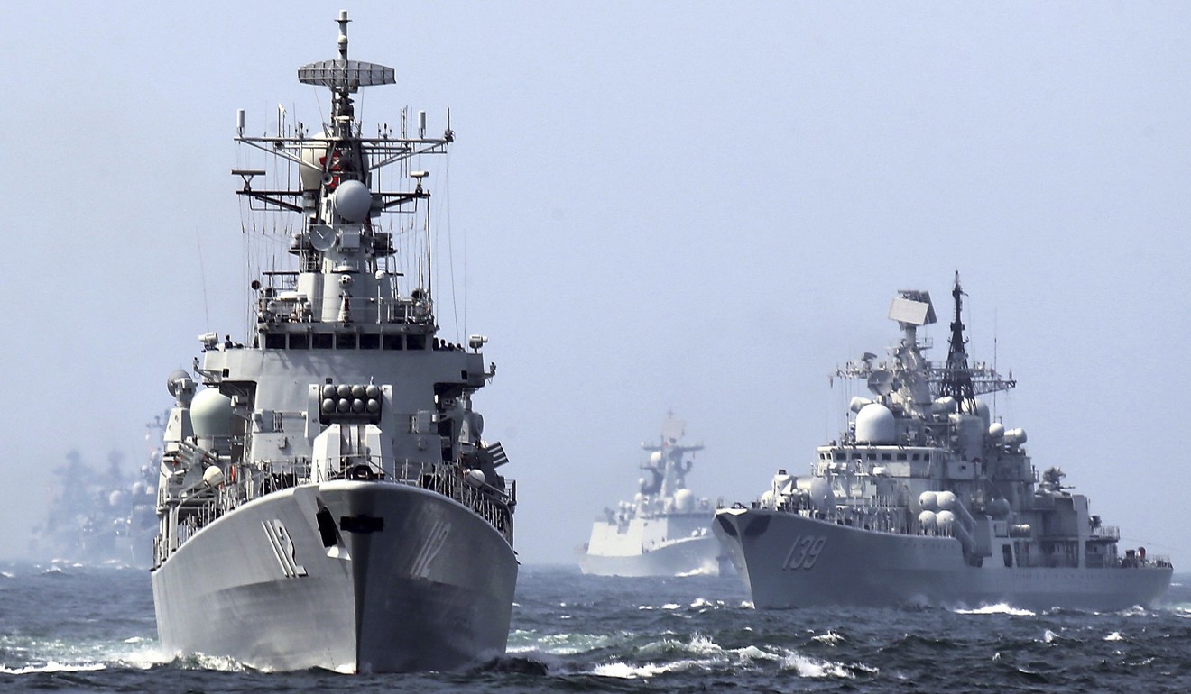 China's Harbin guided missile destroyer (left) and DDG-139 Ningbo Sovremenny class Type-956EM destroyer are seen during naval exercises in 2014. Photo: Chinatopix via AP