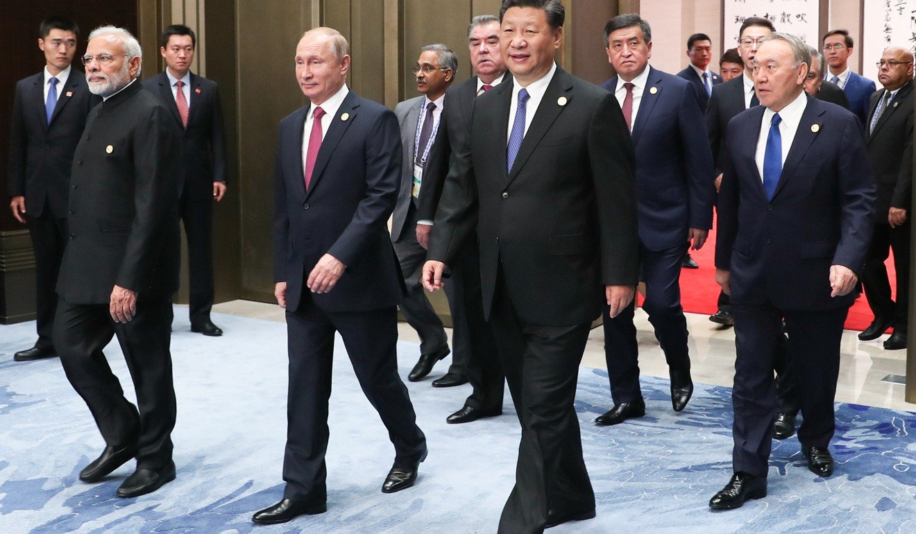 Chinese President Xi Jinping walks out in front of other leaders including Indian Prime Minister Narendra Modi and Russian President Vladimir Putin ahead of a restricted session of the 18th Shanghai Cooperation Organisation summit in Qingdao on June 10. Photo: Xinhua
