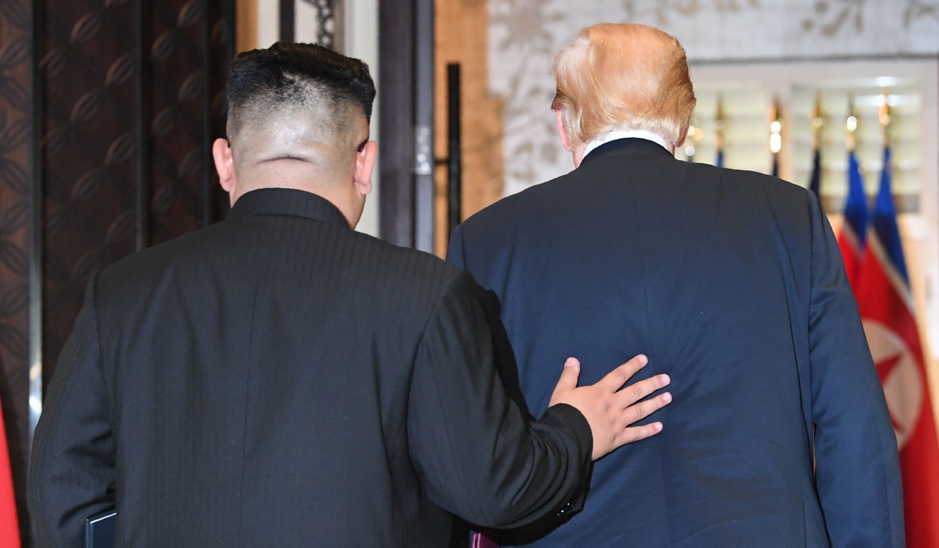North Korean leader Kim Jong-un (left) and US President Donald Trump leave after a signing ceremony during their historic US-North Korea summit, at the Capella Hotel on Sentosa Island in Singapore on Tuesday. Photo: AFP