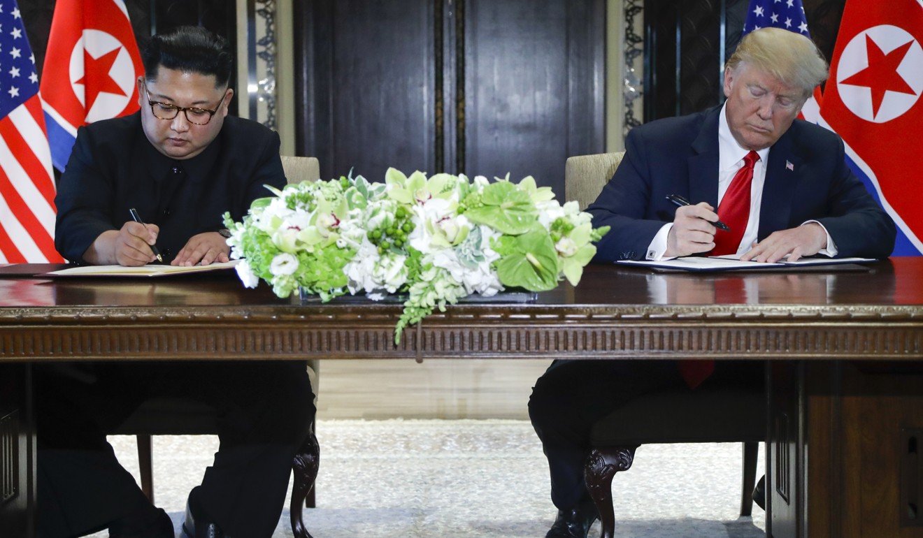 North Korea leader Kim Jong-un and US President Donald Trump sign a relatively vague statement agreeing to “work towards complete denuclearisation”. Photo: AP