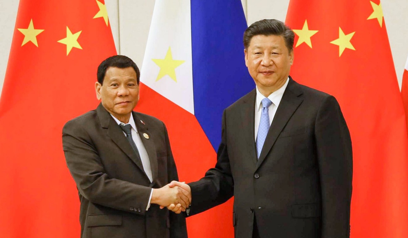 Philippines President Rodrigo Duterte shakes hands with Chinese President Xi Jinping during a meeting in April. A group of left-wing activists heckled and disrupted a televised Independence Day speech by the Philippine president and called him a “traitor” amid criticism of his handling of territorial disputes with China. Photo: EPA