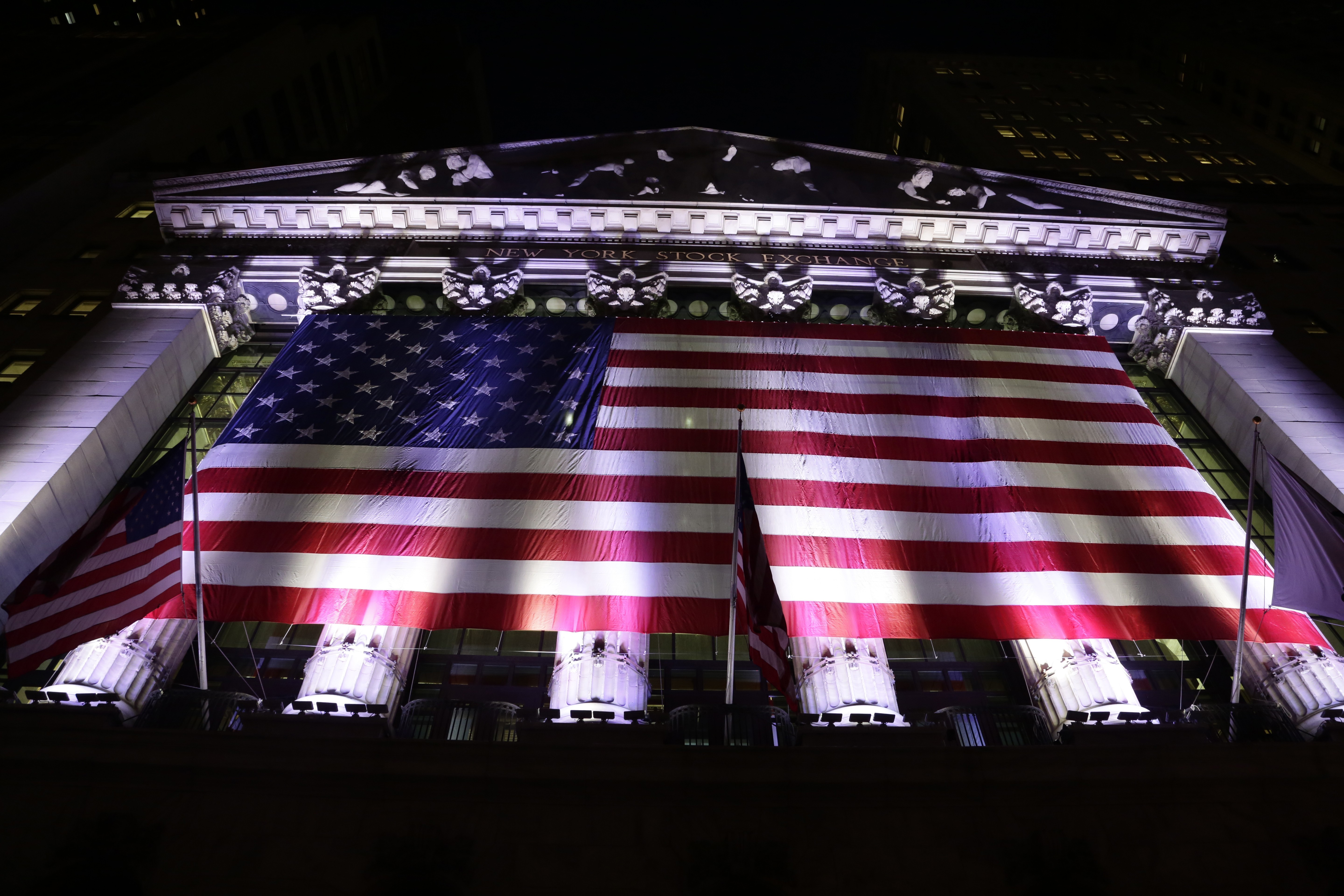 An American flag hangs on the front of the New York Stock Exchange in February 2017. Photo: AP